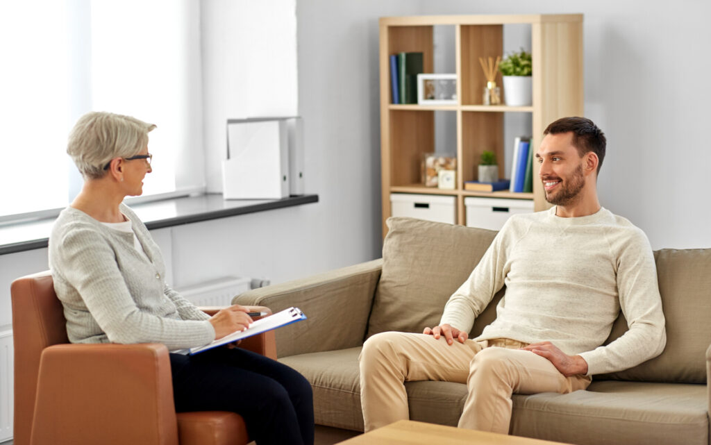 Compassionate therapist supporting a client during an individual counseling session.